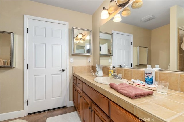 bathroom with vanity and tile patterned floors