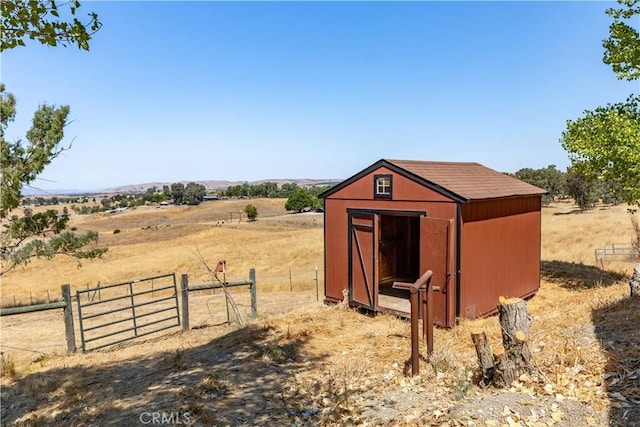 view of outbuilding with a rural view