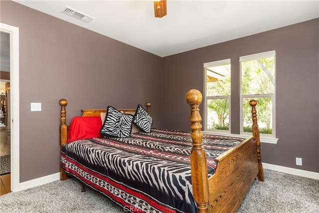 bedroom with ceiling fan and light carpet