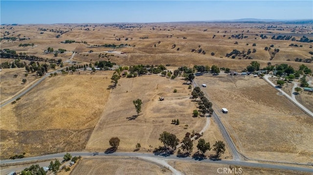 birds eye view of property with a rural view