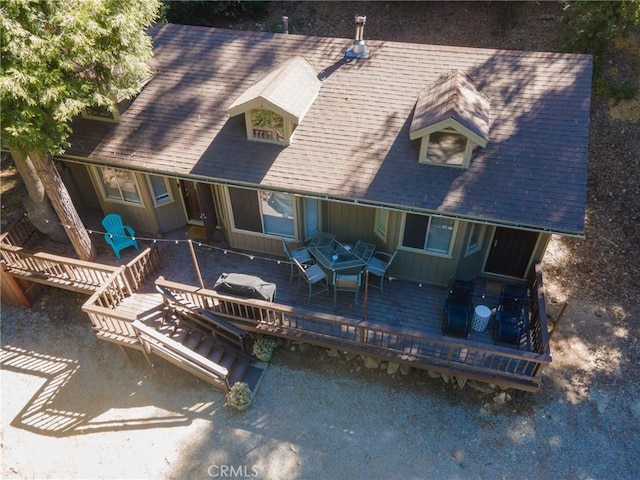 back of house with a wooden deck