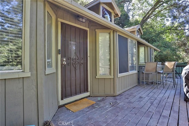 property entrance with a wooden deck