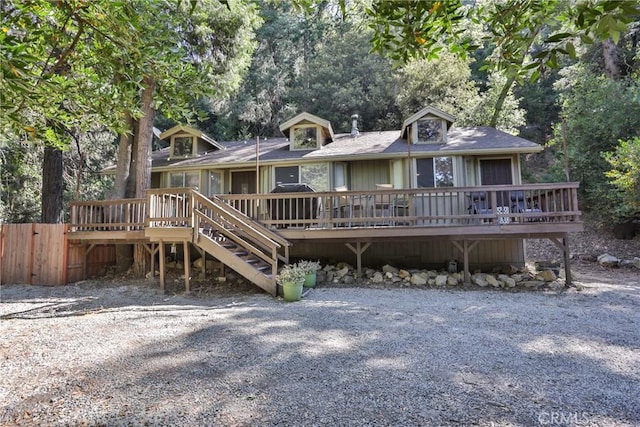 rear view of property with a deck