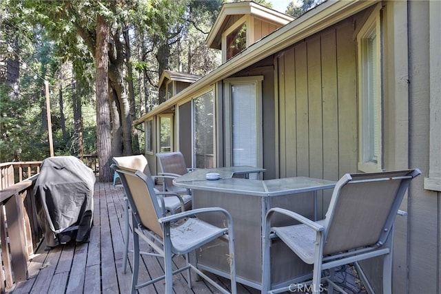 wooden deck featuring grilling area