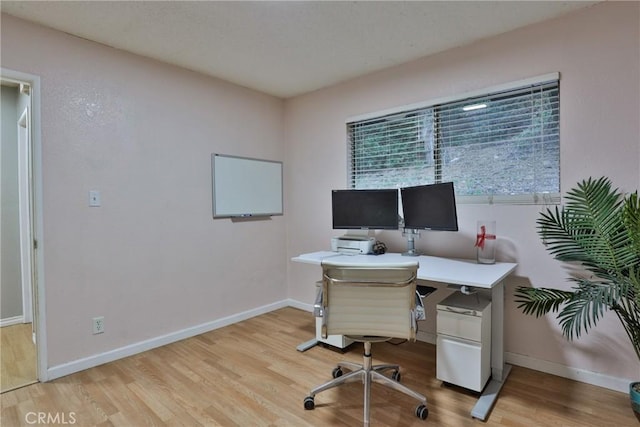 home office featuring light hardwood / wood-style flooring