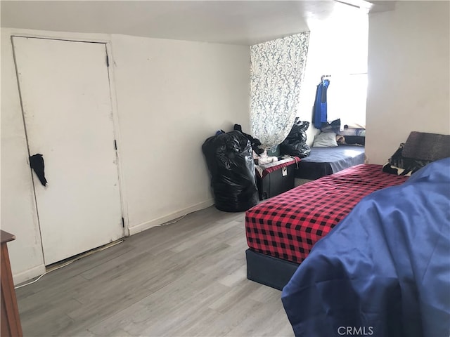 bedroom with wood-type flooring