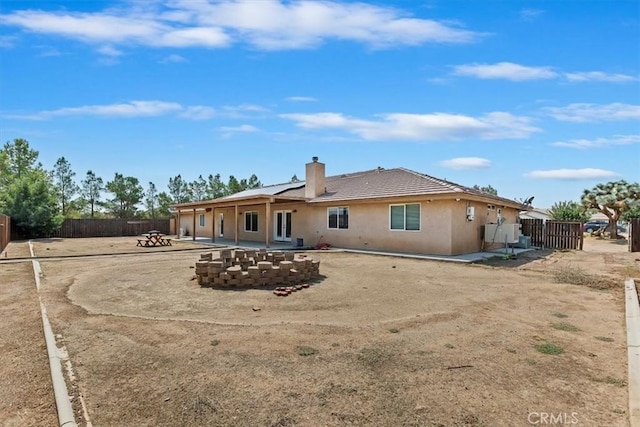 rear view of property featuring a patio area