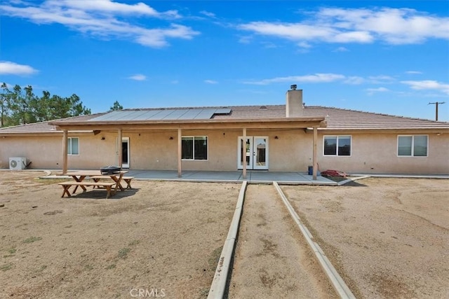 back of house with a patio area