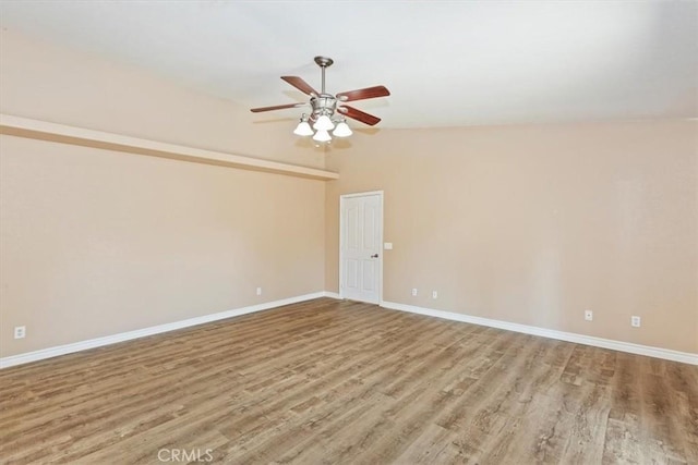 unfurnished room featuring vaulted ceiling, ceiling fan, and light hardwood / wood-style floors