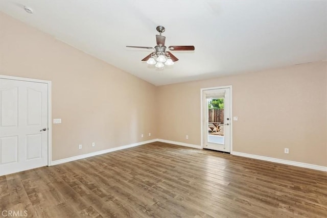 unfurnished room with lofted ceiling, hardwood / wood-style floors, and ceiling fan