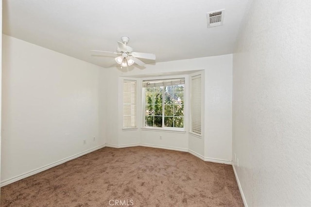 carpeted empty room with ceiling fan