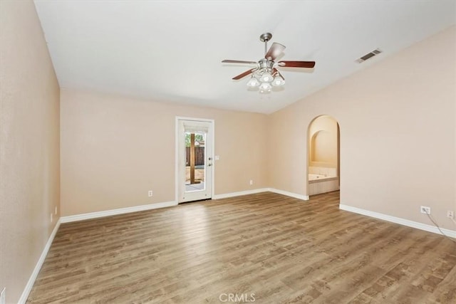 unfurnished room featuring hardwood / wood-style floors and ceiling fan