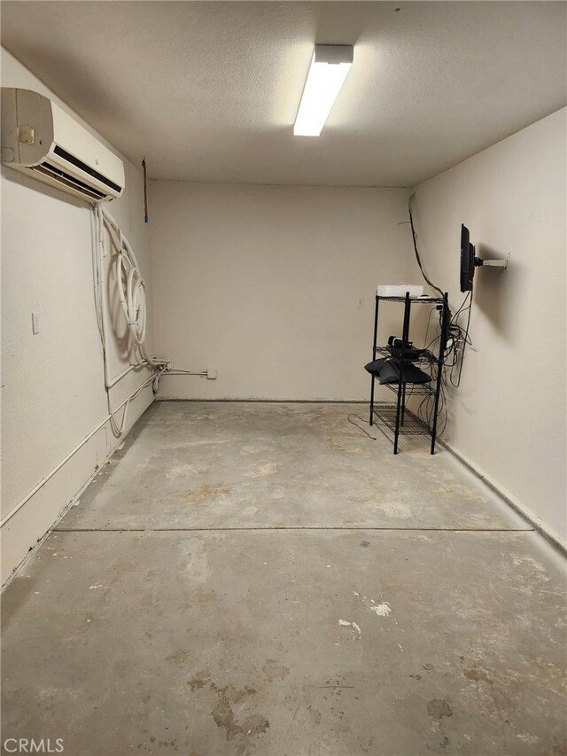 basement with a wall mounted air conditioner