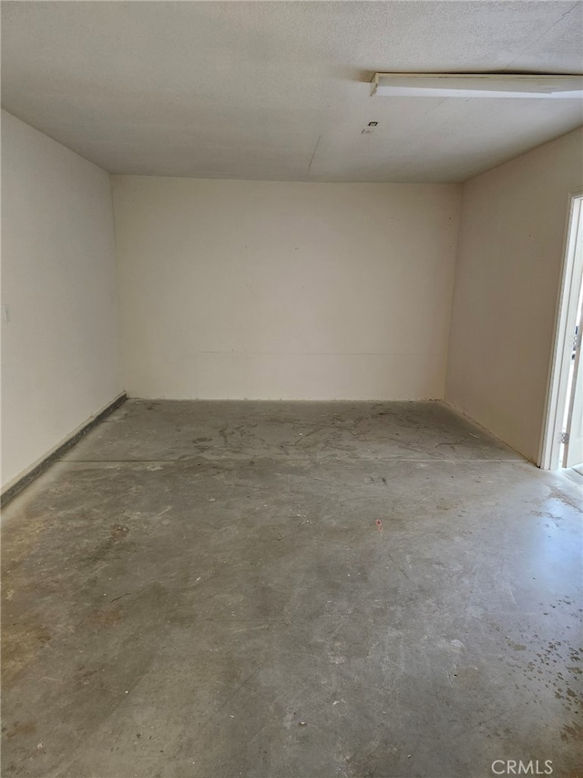 empty room featuring concrete flooring