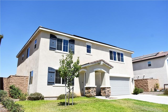 view of front of home with a garage and a front lawn