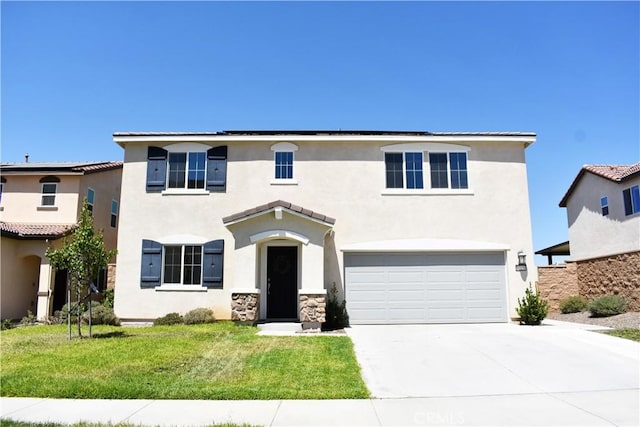 view of front facade with a front yard and a garage