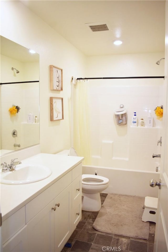 full bathroom with toilet, vanity, and bathing tub / shower combination