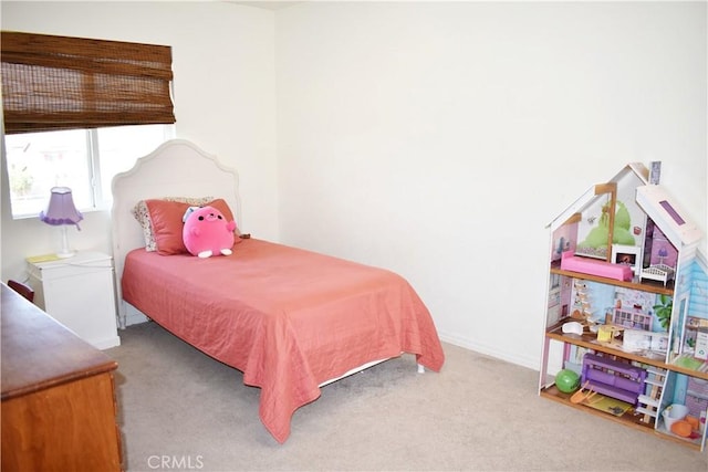 bedroom with light carpet