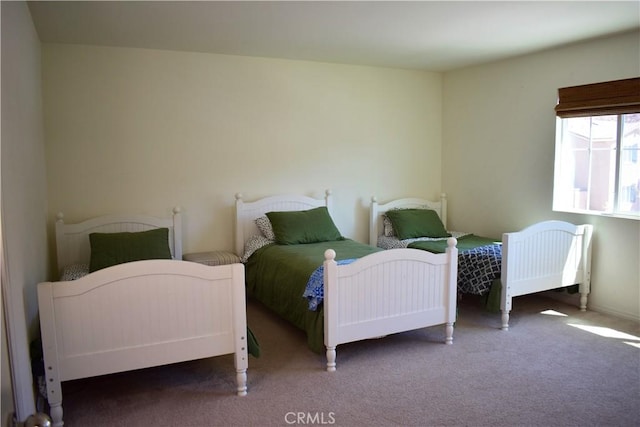 bedroom featuring radiator heating unit and carpet floors