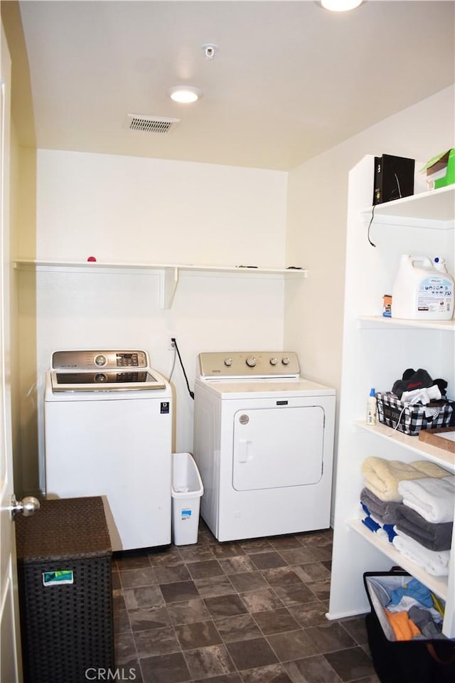 laundry room with washing machine and dryer