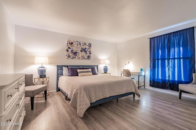 bedroom featuring hardwood / wood-style floors