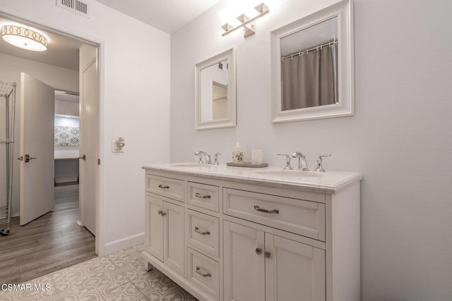 bathroom featuring vanity and tile patterned flooring