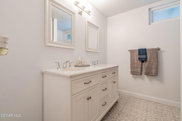 bathroom with vanity and tile patterned flooring