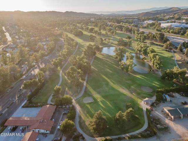 birds eye view of property with a water and mountain view