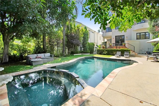 view of swimming pool featuring a patio area, an in ground hot tub, and an outdoor hangout area