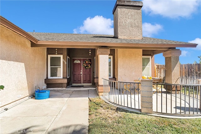 property entrance featuring covered porch