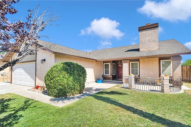 ranch-style home with a front lawn and a garage