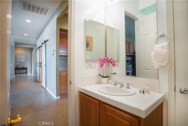 bathroom with vanity and tile patterned floors