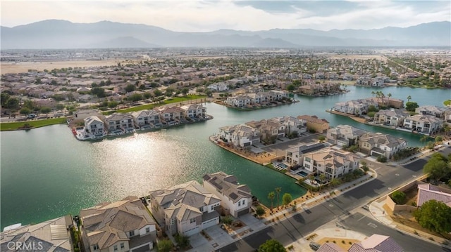 bird's eye view with a water and mountain view