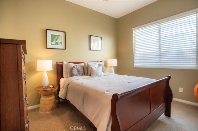 bedroom featuring light carpet