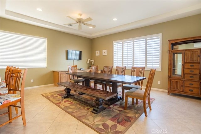 dining room with ceiling fan and light tile patterned flooring