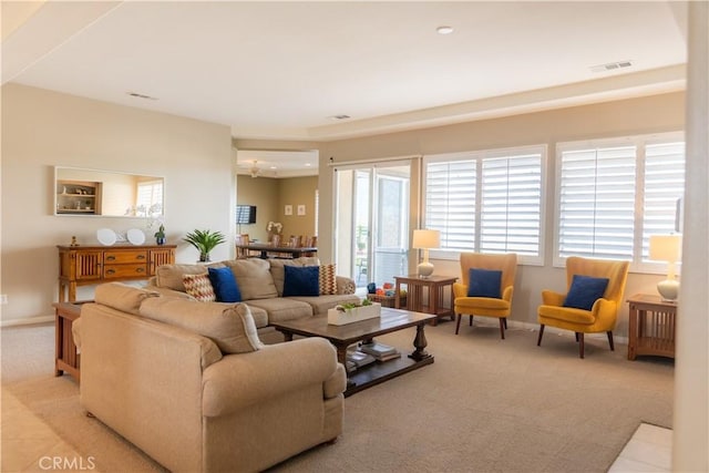 living room featuring a wealth of natural light and light carpet