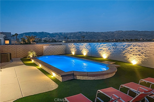 view of pool featuring central AC and a mountain view