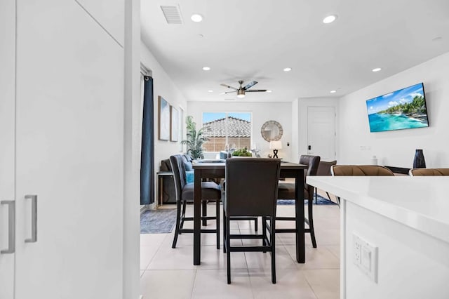 dining room featuring ceiling fan and light tile patterned flooring