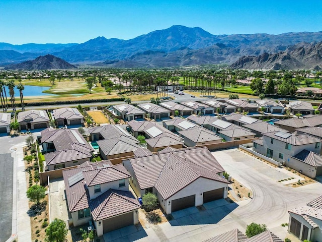 aerial view featuring a water and mountain view