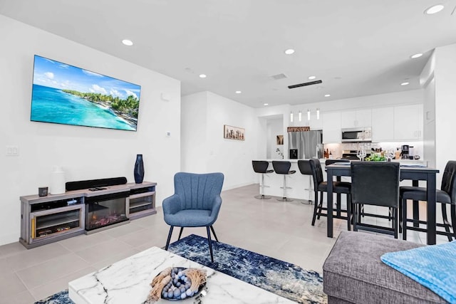 living room with light tile patterned floors