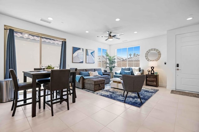 tiled living room featuring ceiling fan