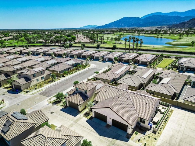 birds eye view of property featuring a water and mountain view