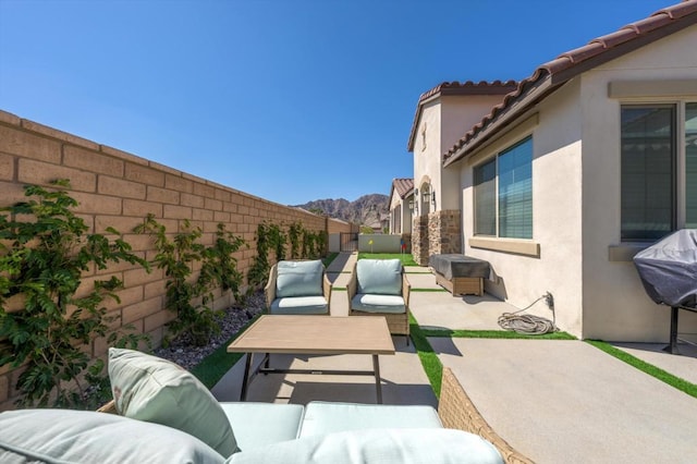 view of patio / terrace featuring a grill and an outdoor living space