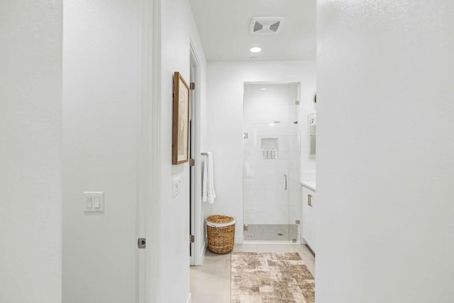 hallway featuring light tile patterned flooring