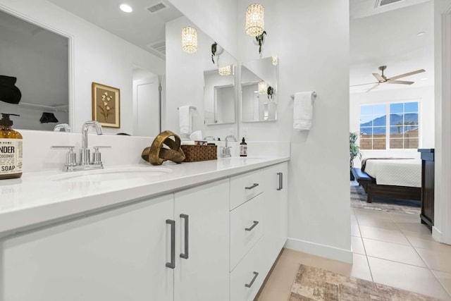 bathroom featuring ceiling fan, vanity, and tile patterned flooring