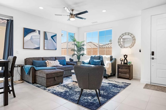 living room featuring ceiling fan and light tile patterned floors