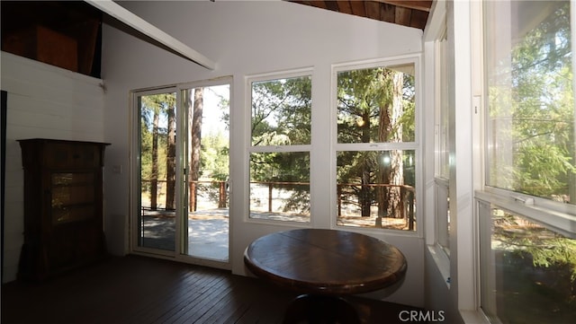 sunroom with wooden ceiling and lofted ceiling