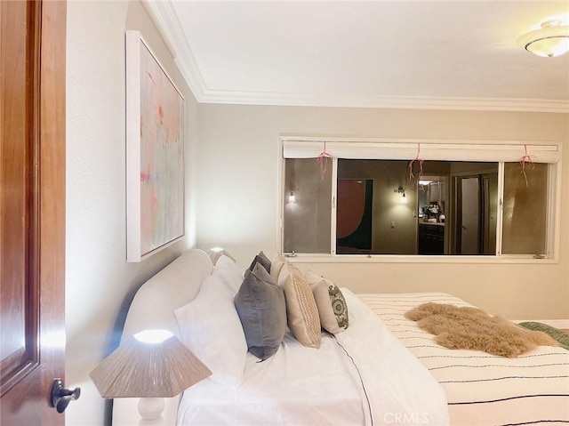 bedroom with ornamental molding