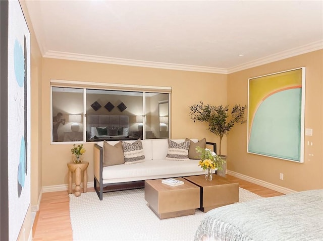 bedroom with hardwood / wood-style flooring, ornamental molding, and a closet