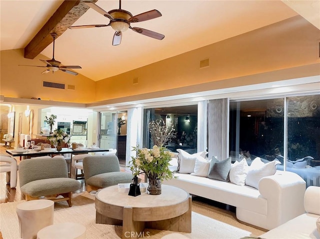 interior space with lofted ceiling with beams and ceiling fan